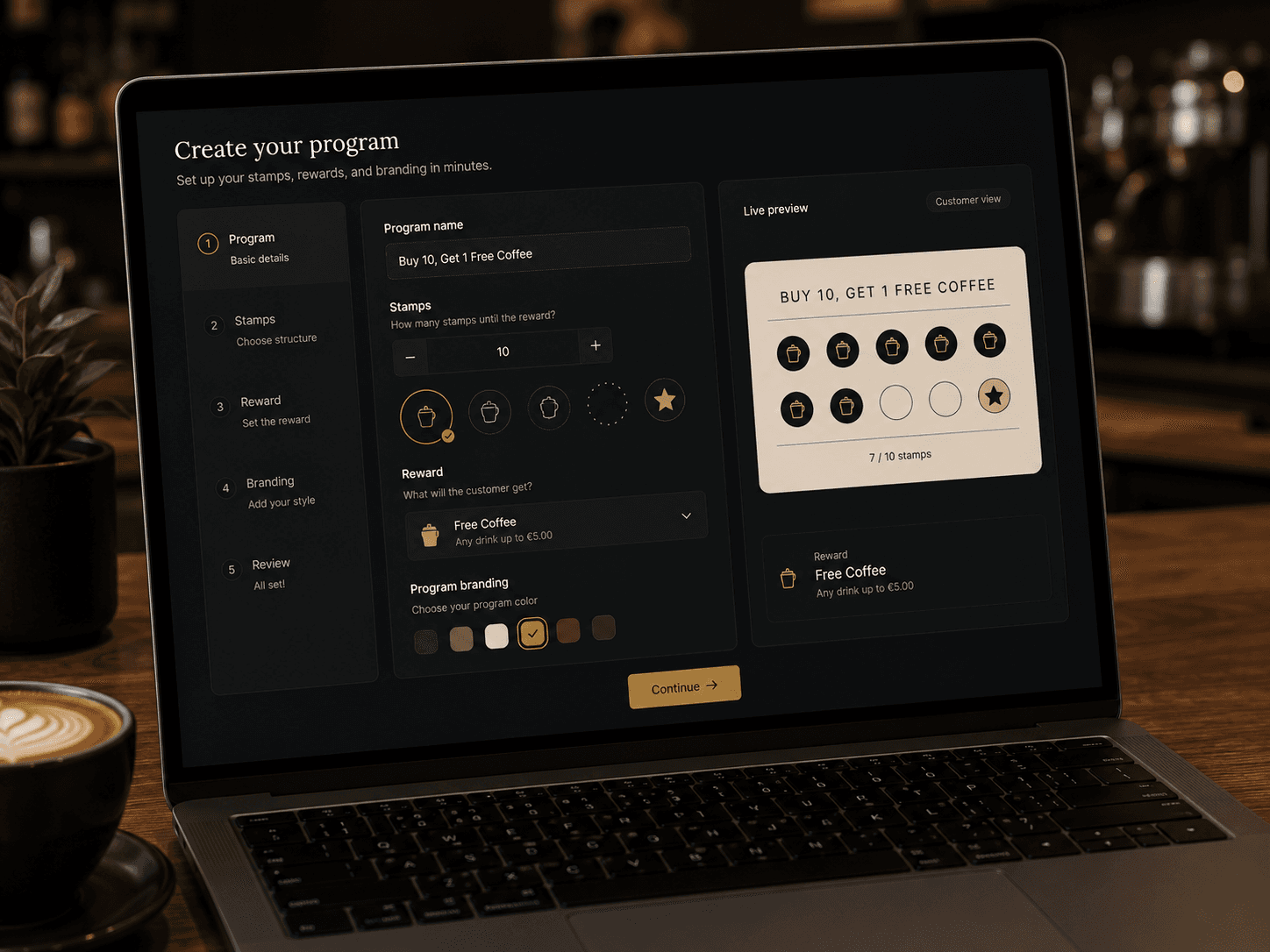 Café owner designing a loyalty program on a laptop, with a live preview of the customer's stamp card.
